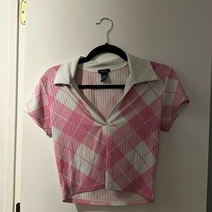 Pink and white cropped shirt.